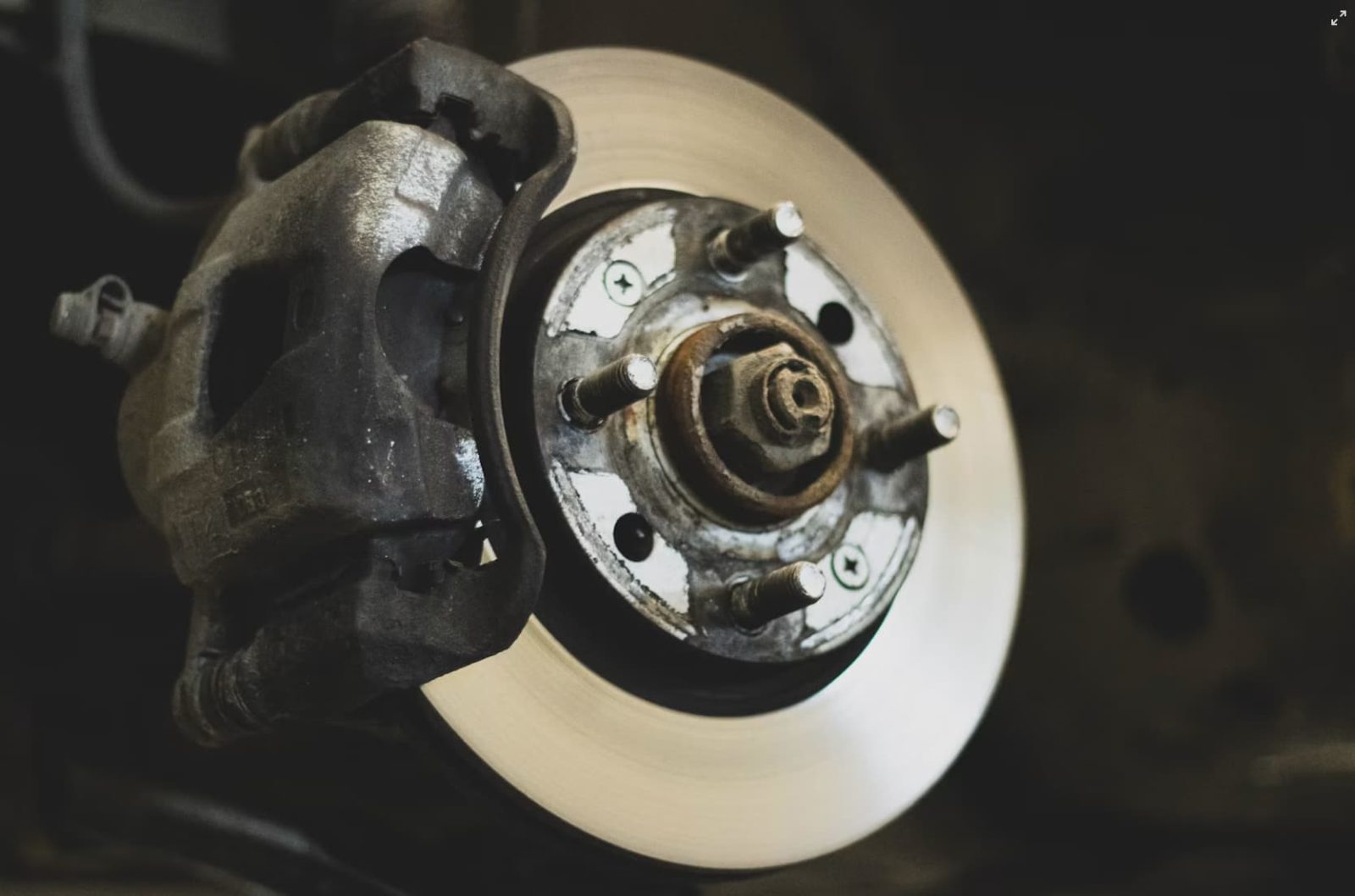 up close shot of brake rotor and caliper